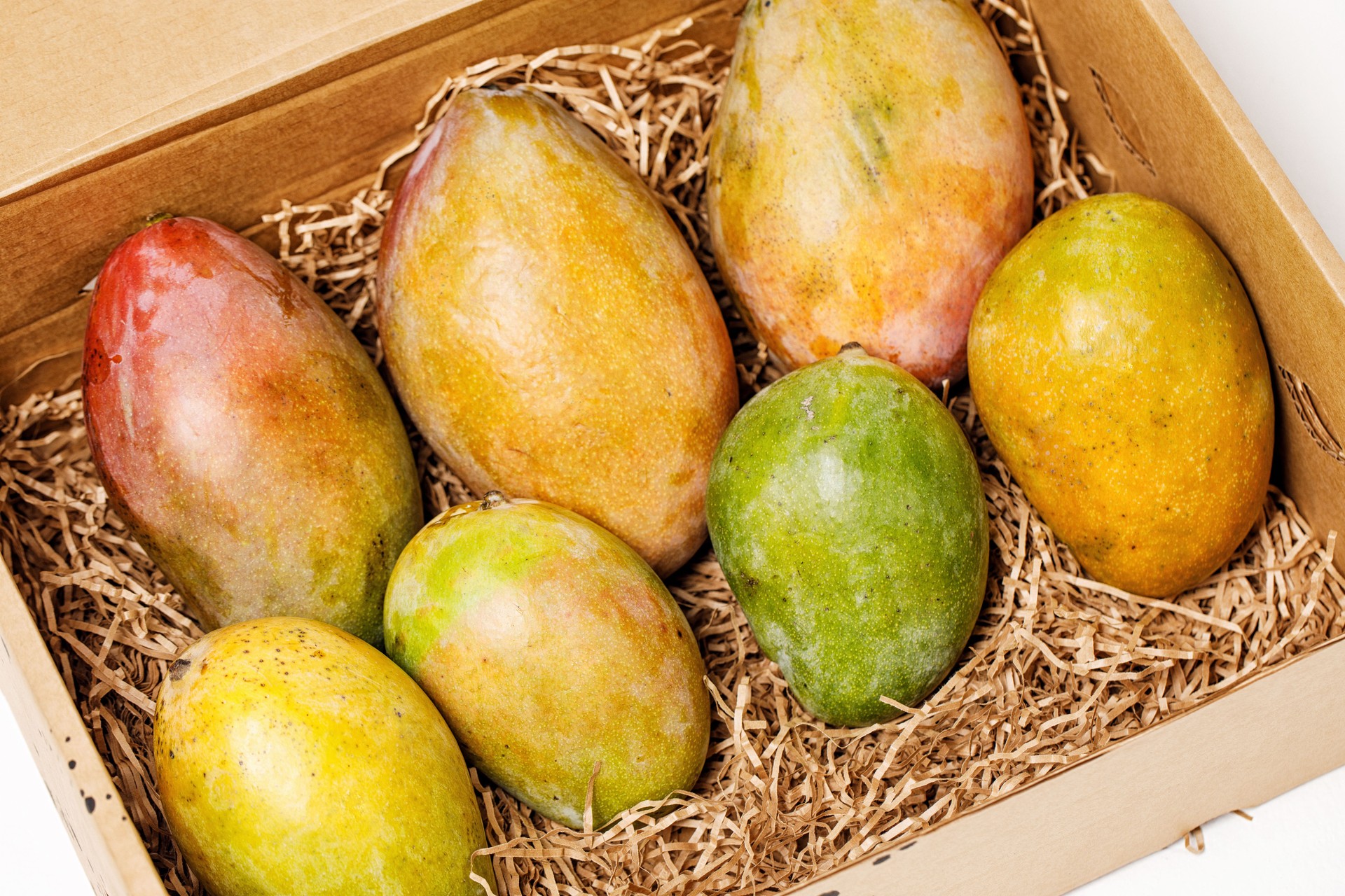 ripe fresh colorful mango in a box